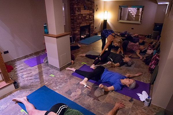 Anne helping her Yoga students.